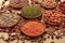 Legumes assortment on a brown background. Lentils, soybeans, chickpeas, red kidney beans