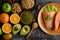 Legumes, fruit and salmon pieces on a wooden plate