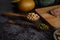 Legumes, salmon pieces and kiwi on a black cement floor background