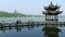 Leifeng Pagoda with stone bridge in West Lake