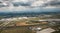 Leipzig DHL cargo hub with main buildings and cargo airplanes parked on apron - aerial view