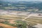 Leipzig DHL cargo hub with main buildings and cargo airplanes parked on apron - aerial view