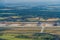 Leipzig, DHL cargo hub with main cargo apron, main buildings and hangar and many cargo airplanes parked on apron - aerial view