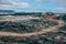 Leirhnjukur old black lava field with a tourist trail and blue sky in Iceland, overcast day in summer , film effect