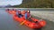 Leisure activity of couple kayaks down Dart River, New Zealand