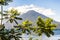 Leisure boat cruises on Lake Atitlan with 2 volcanoes behind, Guatemala