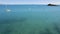 Leisure Boats Anchored In A Bay Beside A Tropical Island