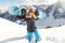 Leisure, winter sport and people concept - happy young woman with blue snowboard outdoors