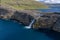 Leitisvatn lake and Bosdalafossur waterfall on Vagar island aerial view