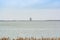 Lelystad, Netherlands - January 09, 2020.   Antony Gormley Exposure Statue - huge statue sitting on the coast of Markermeer