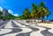 Leme beach and Copacabana beach with palms and mosaic of sidewalk in Rio de Janeiro