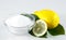 Lemon acid and lemon fruits on the white background.