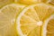 Lemon background. Close up view of lemon slices. Citrus texture