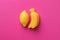 Lemon and banana sweet marmalade candy on pink background