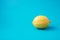 Lemon on a blue background.Vitamins, beautiful colors. Style minimalism. Vegetarian raw food.