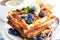 Lemon blueberry waffles with honey