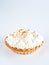 Lemon Curd and Meringue Mini Tart Pie on white background, selective focus, copy space. Bakery pastry dessert concept