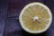 Lemon cut open on mahogany wooden background