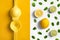 Lemon juicer. hand press, on split colored background with lemon lime and mint leaves