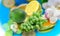 Lemon lime grape orange and ananas with  orchids flowers but on blue  white yellow background fruite leaves  berry  copy space tem