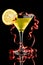 Lemon martini with red streamer