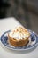 Lemon meringue tart on table in sweet cafe