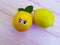 Lemon orange cartoon looking eyes wooden personage