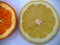 Lemon and orange slices on white