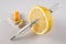 Lemon, pills , vitamins with thermometer on white background