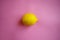 Lemon on pink background, trendy healthy lifestyle background