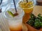 Lemon and Plum soda in transparent plastic cup