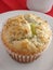 Lemon poppyseed muffin on white plate