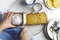 Lemon pound cake. Top View of Woman Cutting Freshly Baked Lemon