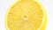 Lemon rotates vertical. Cut citrus juicy yellow fruit. Macro close-up footage.