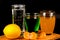 Lemon, segments of tangerine and glasses with drinks