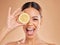 Lemon, skincare and face of woman with excited smile in studio for wellness, facial treatment and natural cosmetics