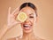 Lemon, skincare and face of woman with smile in studio for wellness, facial treatment and natural cosmetics. Beauty, spa