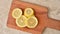 Lemon slices appearing on a cutting board