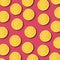 Lemon slices pattern on vibrant pomegranate color background