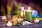 Lemon soap , oil, towel, salt, bamboo, and candles in garden