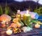 Lemon soap , oil, towel, salt and candles in garden