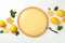 Lemon tart, mint and lemons on background, top view