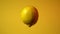 Lemon. Video of a lemon fruit floating in the air and rotating around a vertical axis.