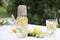 Lemonade with fresh linden flowers, lemon and apple slices