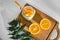 Lemonade in a glass bowl with a straw. view from above. oranges cut on the table. healthy natural vitamin drinks. organic food