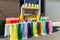 lemonade stand with a variety of colorful cups, straws, and lemons for customers to choose from