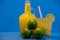 Lemonade and Thaiti lemon juice Citrus Ã— latifolia in glass bottle on blue background