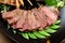 Lemongrass grilled beef steak with snow peas