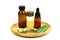 Lemongrass oil in bottle and fresh lemongrass sliced in wooden plate