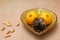 Lemons in a bowl with vitamin C tablets